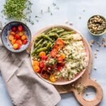 Colorful healthy meal prep containers filled with balanced nutritious food