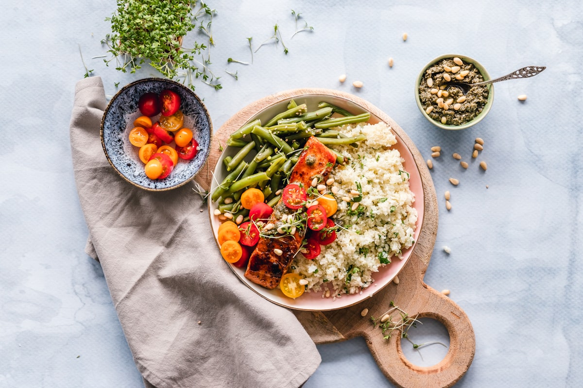 Colorful healthy meal prep containers filled with balanced nutritious food