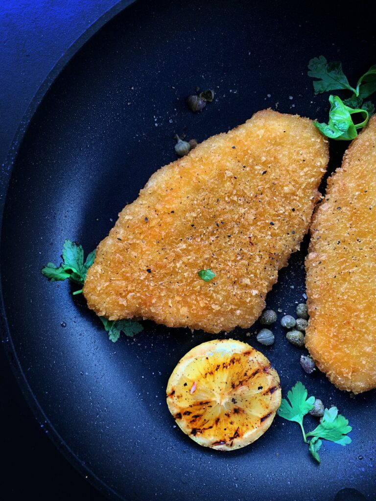 Crispy golden food cooking in a modern air fryer basket