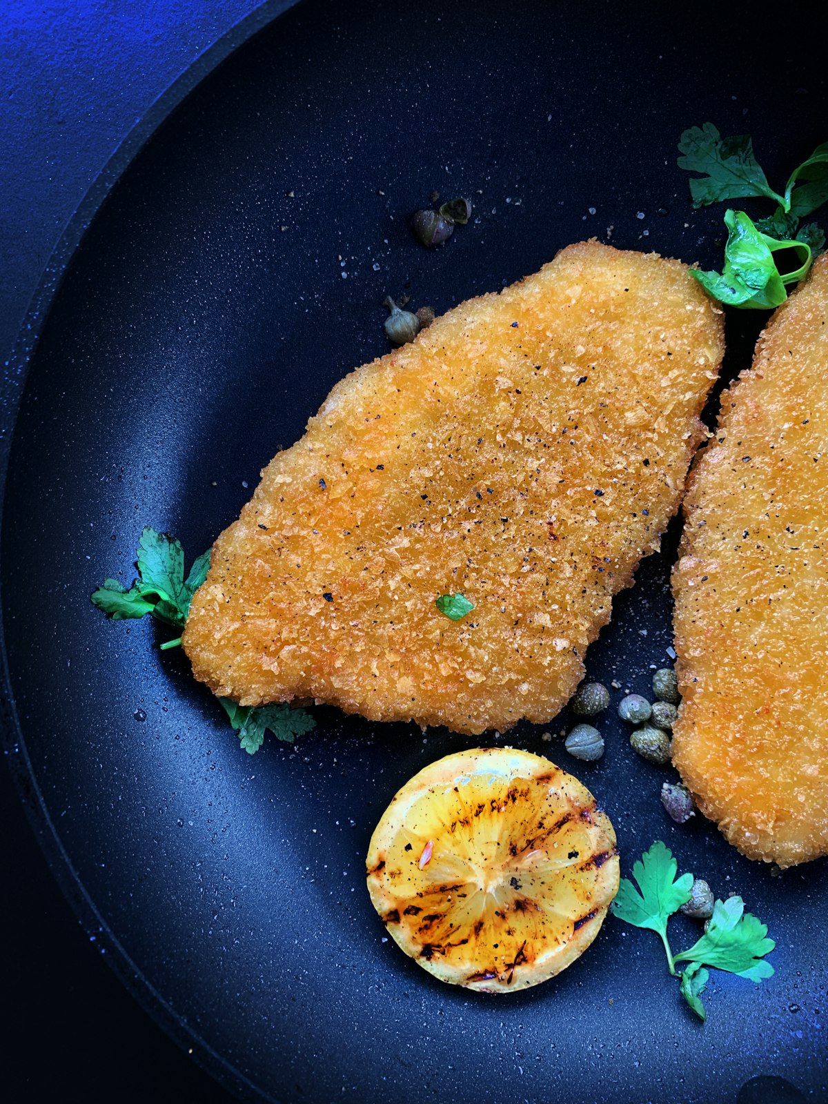 Crispy golden food cooking in a modern air fryer basket