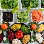 Fresh ingredients and meal kit delivery box with colorful vegetables and recipe card