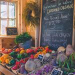 Fresh organic produce at a farmers market with colorful fruits and vegetables