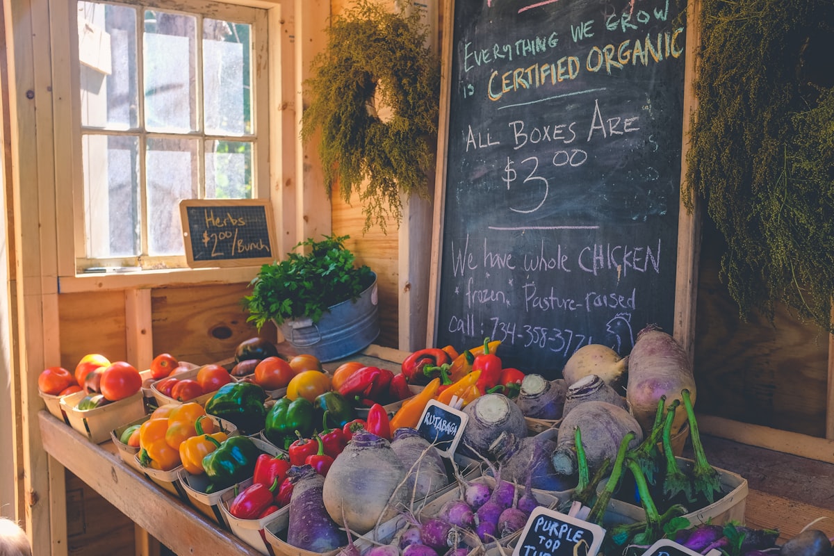 Fresh organic produce at a farmers market with colorful fruits and vegetables